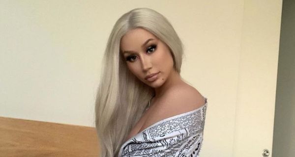 Iggy Azalea Shows Off Her Body In Silky Newspaper Robe