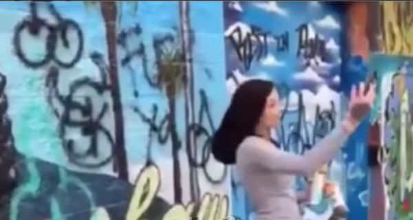 Female Disrespects Nipsey Hussle Mural With "SK" Tag