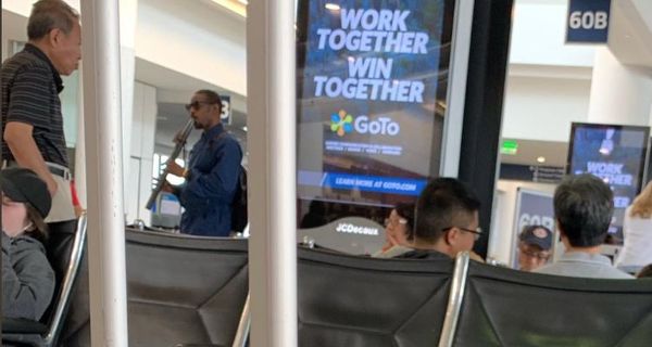 Andre 3000 Spotted Playing The Flute In The Airport