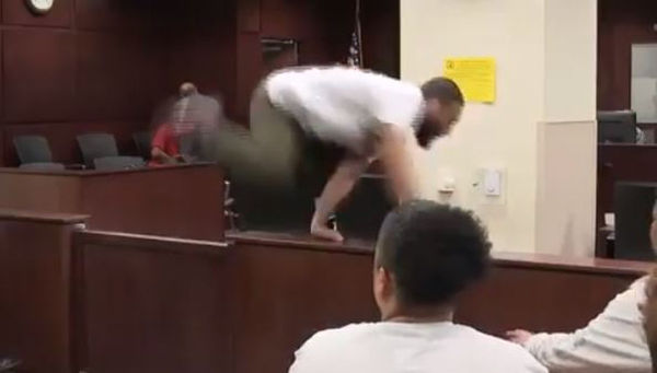 Man Jumps Over Two Court Barriers to Attack His Mom's Murderer