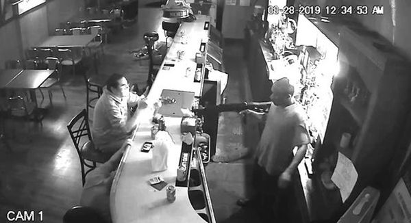 Guy Who Gives The Least Fs Ever Lights Cigarette As Bar is Robbed