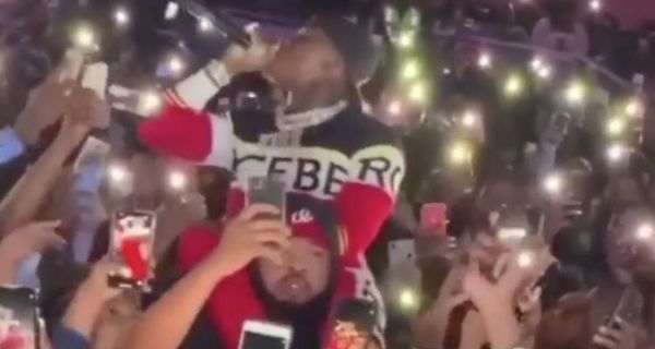 DaBaby Performs On His Security Guards Shoulders In A Crowd