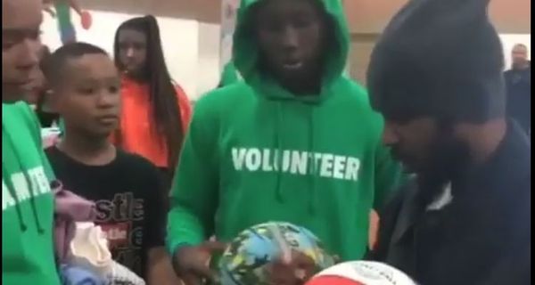 Kendrick Lamar Signs Autographs & Meets Fans At Compton Toy Giveaway