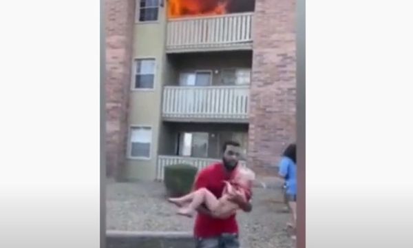 Watch an Ex-College Football Player Catch a Child Thrown from a Burning Building