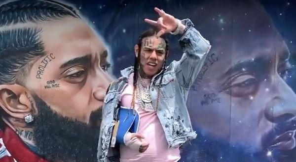 Watch Troll King Tekashi 6ix9ine Post Up In Front Of Nipsey Hussle Mural