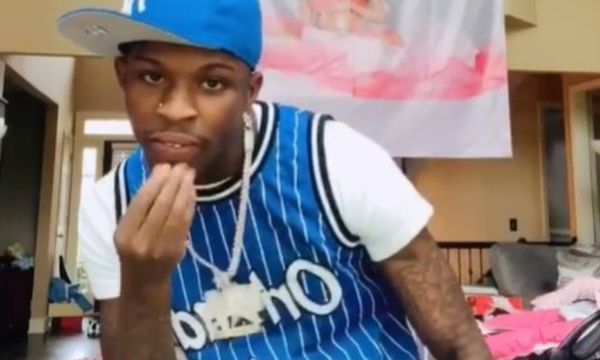 Quando Rondo Posts Up In Chicago With a Rifle
